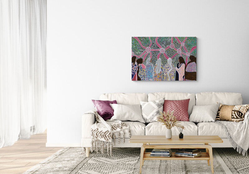 Journey of the Seven Sisters canvas artwork above a cream sofa with purple cushions